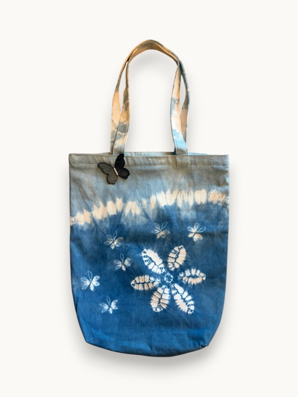 Butterfly Blossom indigo tote with floral pattern