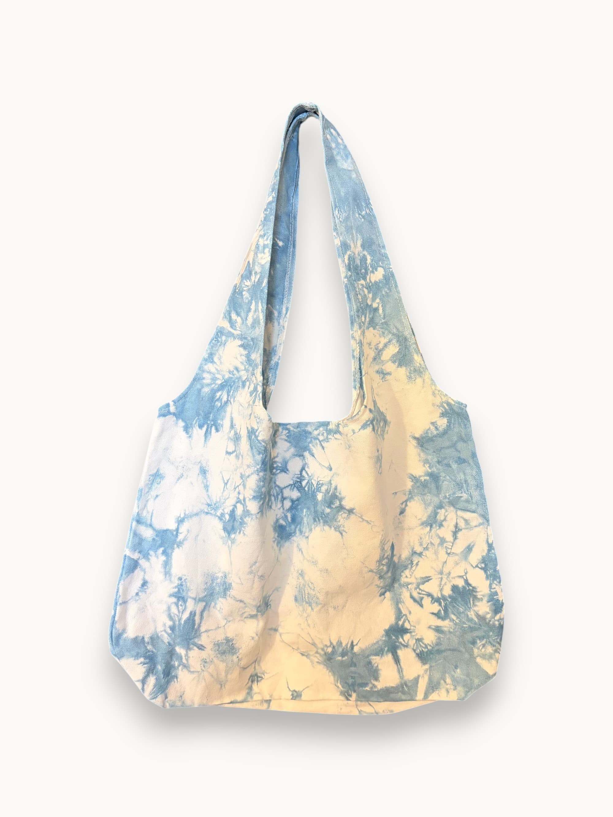 Dali marbled indigo tote hanging on workshop rack